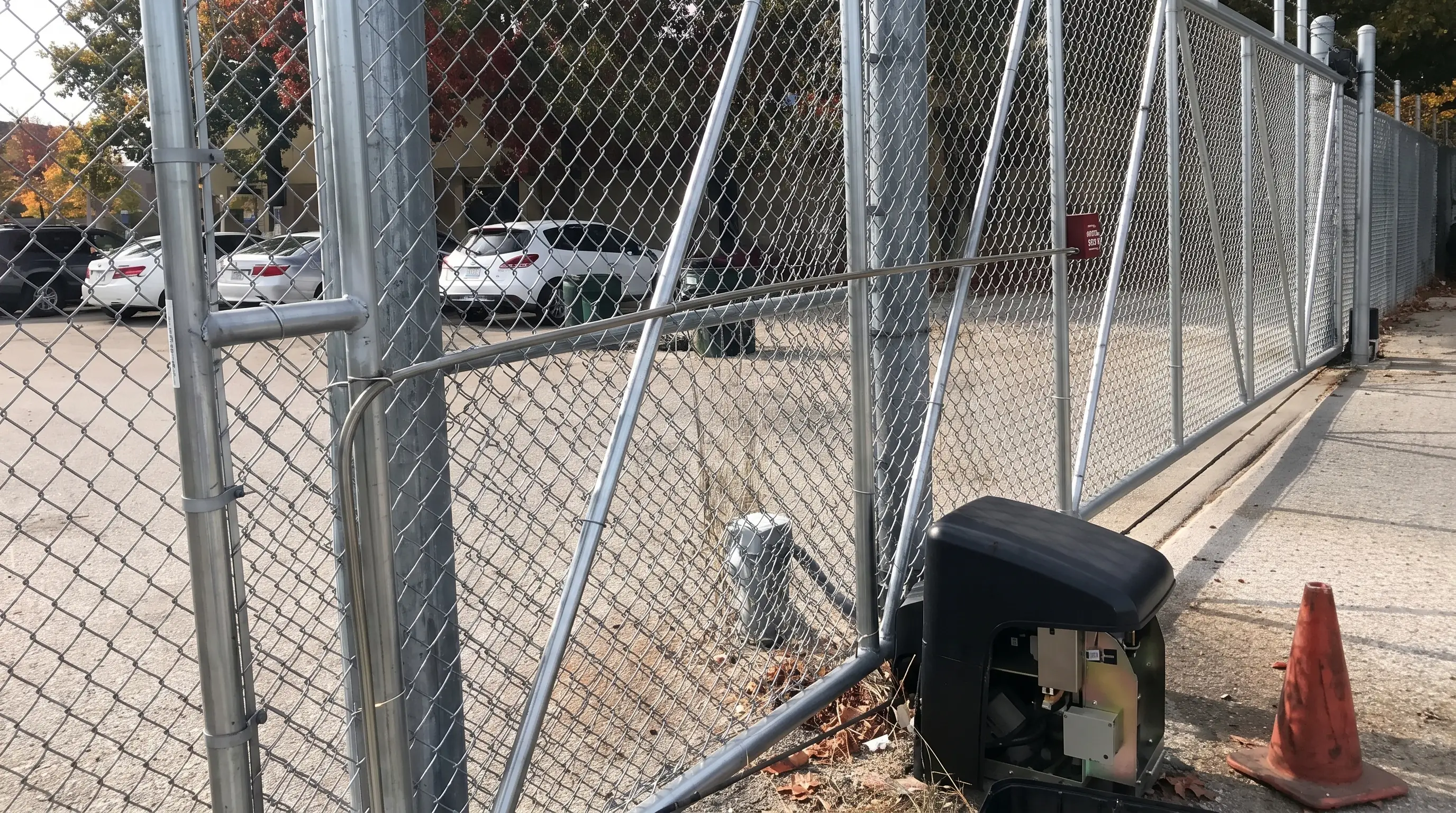 Chain link fence with automatic opener
